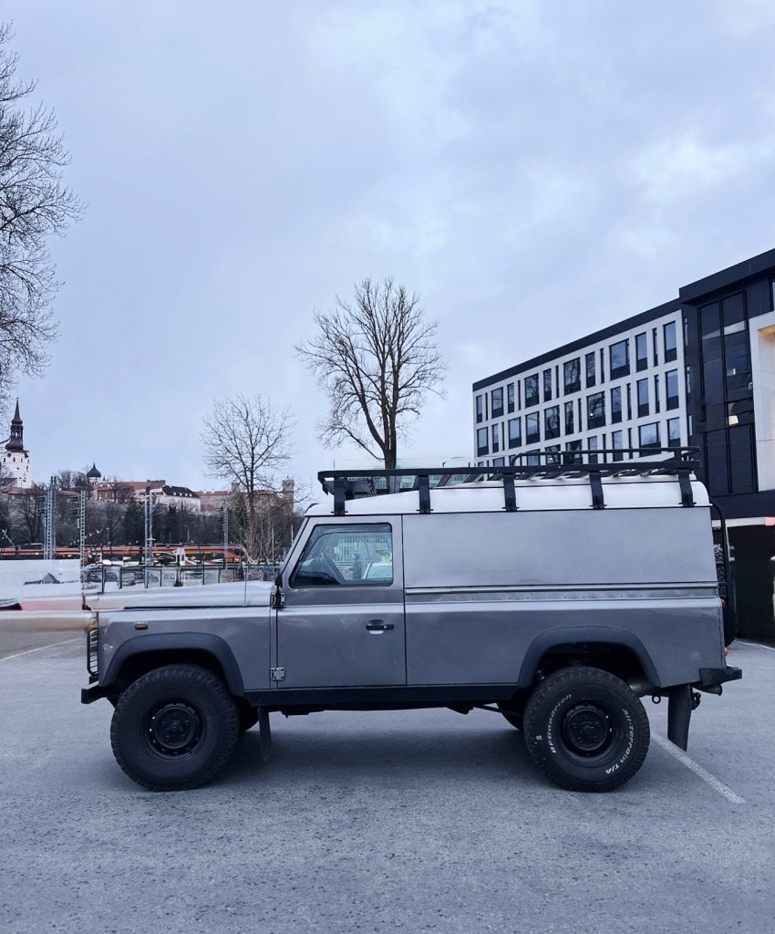 Blue Land Rover Defender sighting in a European cobblestone street