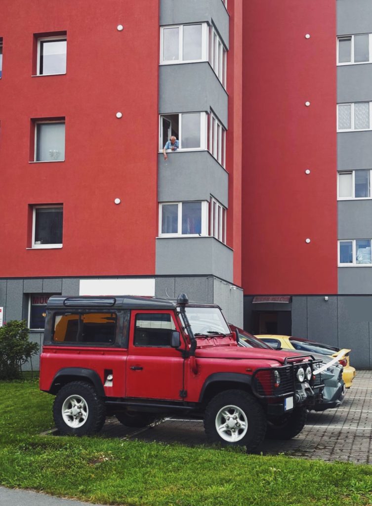 Red Land Rover Defender with custom modifications in Estonia