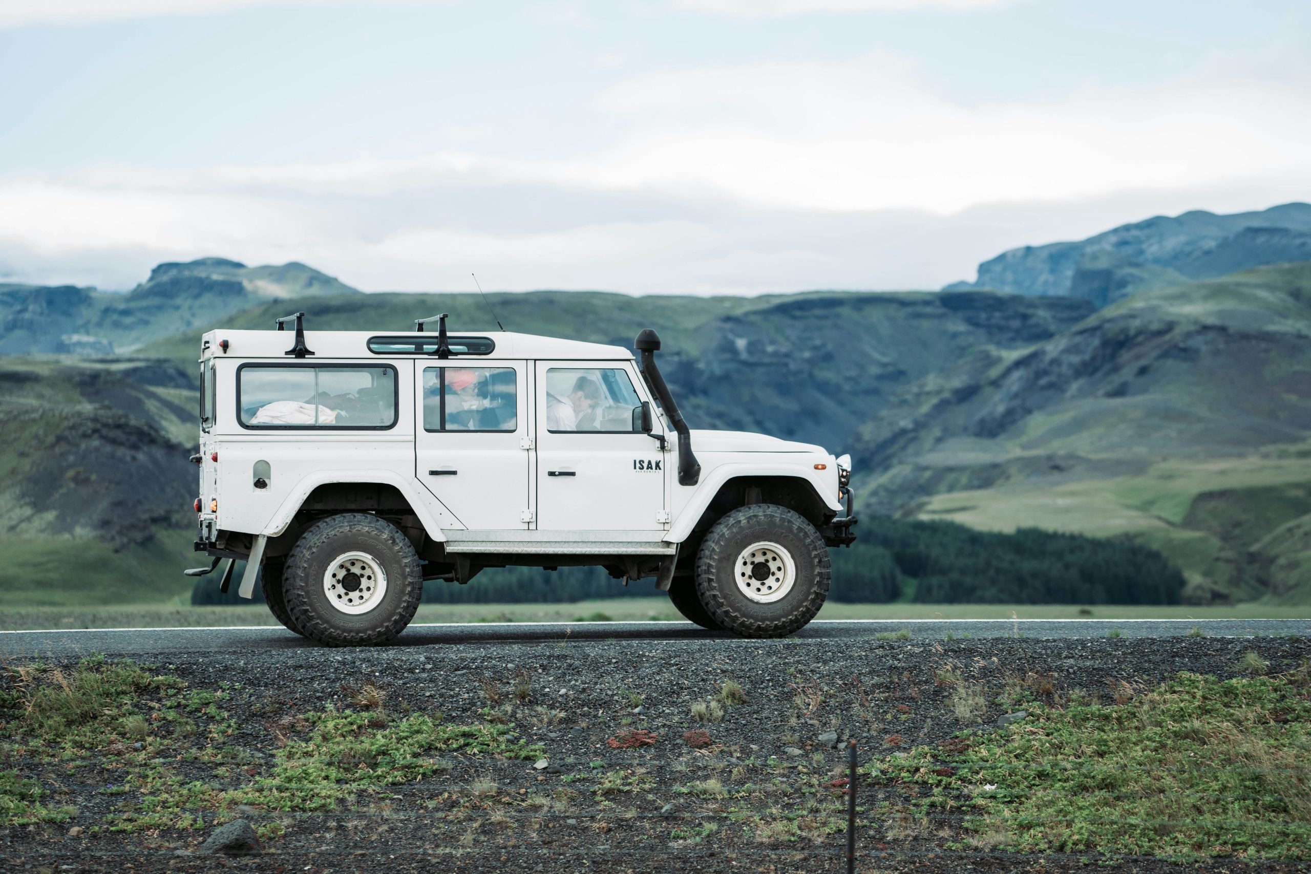 Classic Land Rover Defender 90 in British racing green — the kind of vehicle whose reliability depends entirely on which engine lives under the bonnet